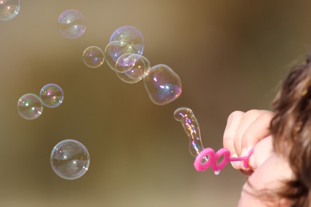 Child blowing bubbles